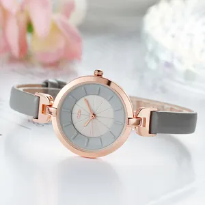 Women's minimalist rose gold quartz watch with grey leather strap and sunray dial