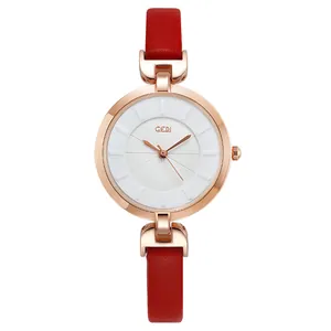 Fashionable women's watch with rose gold case, white dial, and elegant red leather strap