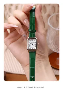 Detail view of GEDI retro square watch with green leather strap and gold metal case