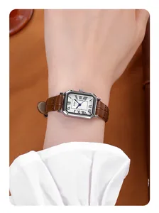 Detail of GEDI vintage square watch with Roman numerals and brown leather strap on wrist
