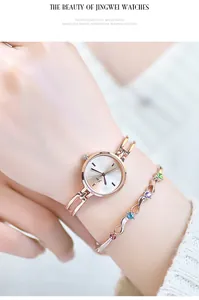 Detailed shot of rose gold quartz watch set with colorful gemstone wave bracelet