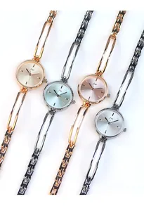 Elegant quartz watches in gold, silver, and blue finishes with unique hollow metal bands