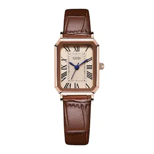 Vintage rose gold rectangular watch with Roman numerals and brown leather strap