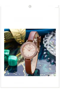 Détail de la montre Gedi or rose avec lunette en cristaux et bracelet cuir brun