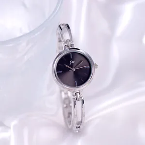 Minimalist silver quartz watch for women with round grey dial and bracelet chain band