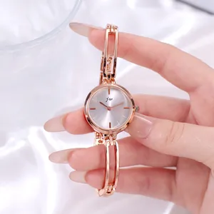 Minimalist rose gold women's watch with silver sunray dial and openwork chain strap