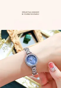 Detail of Gedi silver mesh bracelet watch featuring a blue sunray dial and crystal bezel