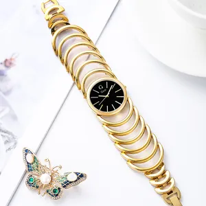 Orologio al quarzo Gedi dorato con quadrante nero e cinturino a catena geometrica boho