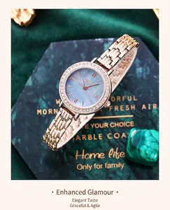 Close-up of rose gold quartz watch with rhinestone bezel and purple gradient dial
