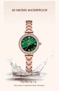 Detail of rose gold watch with green malachite dial and water splash effect showing 3ATM