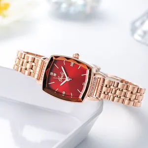 Elegant rose gold square watch with red dial and rhinestone accents on a white display