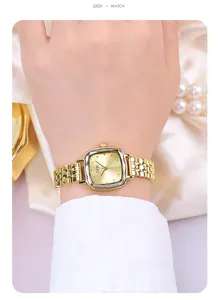 Elegant gold square watch shown on wrist with metal chain strap and champagne sunray dial