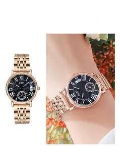 Detail view of GEDI rose gold watch featuring a black sunray dial and roman numerals