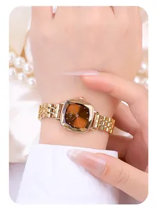 Close-up of GEDI women's rose gold square quartz watch with a gradient amber dial