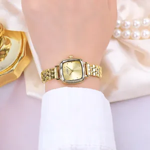 Elegant gold square quartz watch with metal chain strap and luxury pearl background