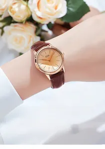 Elegant GEDI quartz watch featuring champagne dial and brown leather bamboo pattern strap