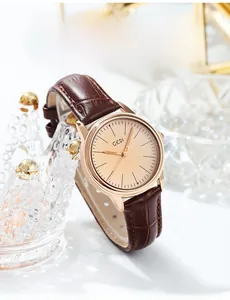 Detail view of GEDI quartz watch with rose gold case and brown bamboo leather strap