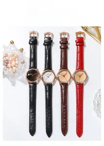 Detailed view of four GEDI women quartz watches with textured leather straps and gold cases