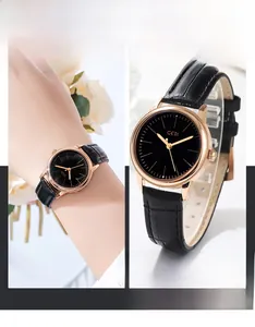 Detailed macro view of the rose gold bezel and black leather strap with GEDI logo