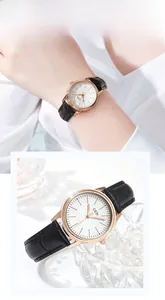 Detail view of quartz watch with rose gold case and black crocodile leather strap