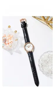 Elegant women's quartz watch with rose gold case and black crocodile leather strap details