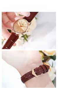 Detail of GEDI quartz watch featuring mineral glass and vacuum plated gold-tone case