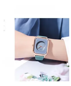 Detailed shot of GEDI square rose gold watch with pastel green strap on female wrist