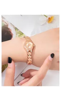 Elegant rose gold small round dial quartz watch with a unique geometric chain strap