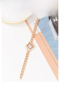 Detailed view of luxury rose gold rhombus watch with zircon inlay and bracelet band