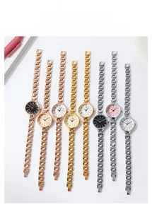 Flat lay of eight stylish women's watches with metallic chain straps in multiple colors