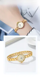 Detail of elegant gold chain watch for women featuring a small round minimalist dial