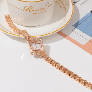 Luxurious rose gold women's watch with square diamond dial and leaf-shaped bracelet band