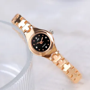 Elegant rose gold quartz watch with a black dial and diamond markers on a glass rim