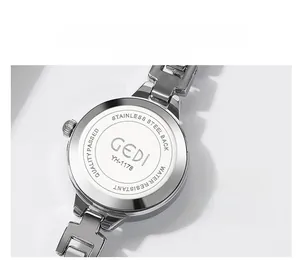 Macro shot of GEDI stainless steel watch back featuring engraved logo and model details