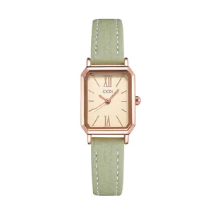 Montre à quartz rectangulaire vintage avec boîtier en or rose et bracelet en cuir vert