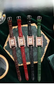 Macro view of four square quartz watches with diamond bezels and colorful leather straps