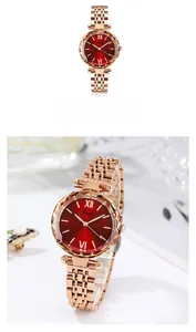 Gros plan détaillé de la montre Gedi en maille or rose avec un cadran rouge foncé effet soleil