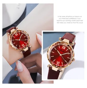Close-up of a women's quartz watch with red sunray dial and faceted glass crystal cover