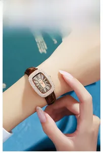 Macro detail of luxury rose gold rectangular watch bezel with sparkling crystals