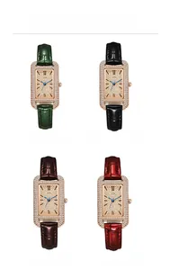 Detailed view of four colorful rectangular crystal watches with rose gold cases