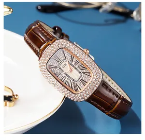 Close-up of luxury GEDI starburst watch with crystal-encrusted dial and leather strap