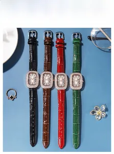 Close-up of four luxury women watches with leather straps and rhinestone oval cases