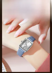 Detailed view of GEDI women's quartz watch featuring a silver rectangular face and blue strap