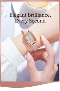 Detail of rose gold rectangular watch with pink gradient dial on a leather strap