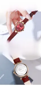 Detail of Gedi red leather watch showing rose gold case and stainless steel back cover