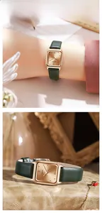 Detail of square rose gold watch with emerald green leather strap and retro aesthetics