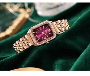 Macro view of GEDI rose gold watch with purple dial and crystal-set octagonal bezel