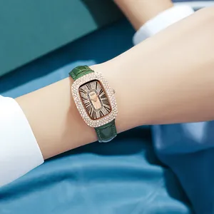 Luxurious rose gold oval women's watch with crystals and dark green leather strap