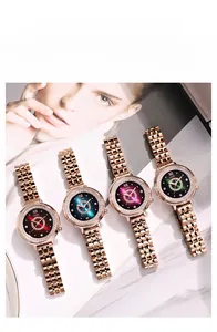 Vue détaillée de quatre montres GEDI avec cadrans étoilés colorés et lunettes serties de diamants