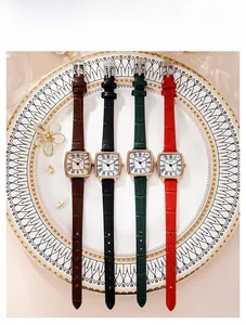 Detail view of retro square quartz watches with crocodile texture leather straps on display